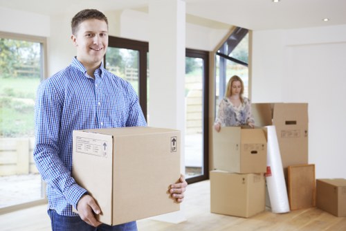 Customers loading furniture into a moving truck